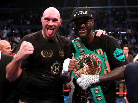 FILE PHOTO: Tyson Fury and Deontay Wilder after their fight at Staples Centre, Los Angeles, United States - December 1, 2018. Action Images via Reuters/Andrew Couldridge/File Photo