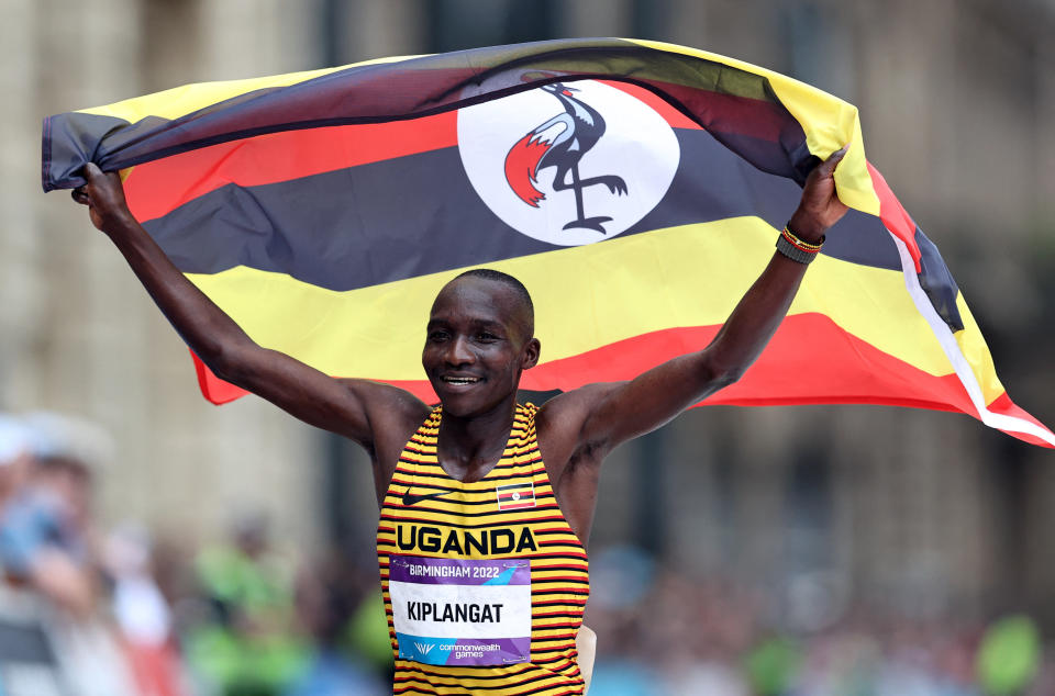 Commonwealth Games - Men's Marathon - Birmingham, Britain - July 30, 2022 Uganda's Victor Kiplangat celebrates after winning the gold medal in the men's marathon REUTERS/Stoyan Nenov