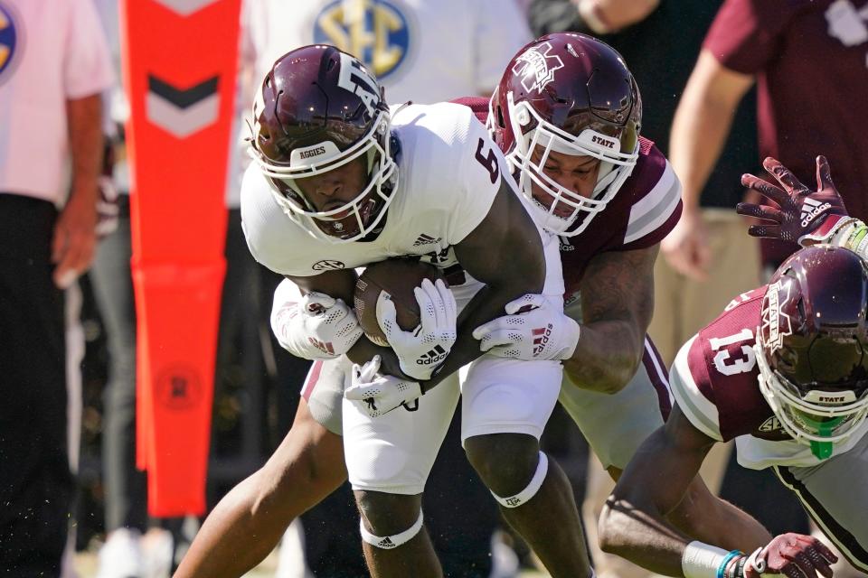 Texas A&M running back Devon Achane (6) is tackled by a Mississippi State player during the first half of their game in Starkville, Miss., Saturday, Oct. 1, 2022.
