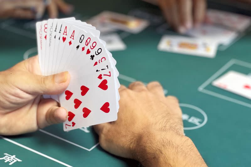 Competition of guandan, a poker-like card game, in Beijing