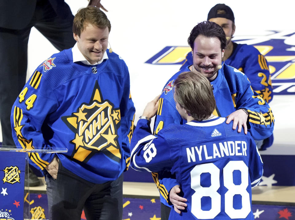 Team Matthews' Auston Matthews, right, and Morgan Rielly, left, pick William Nylander (88) first during the NHL All-Star hockey week draft in Toronto on Thursday, Feb. 1, 2024. (Nathan Denette/The Canadian Press via AP)