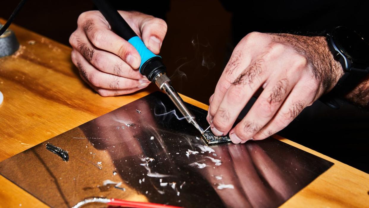 soldering iron in use