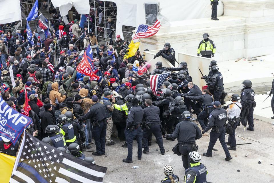 Pro-Trump protesters and police clash on Jan. 6, 2021, at the U.S. Capitol. <a href="https://www.gettyimages.com/detail/news-photo/pro-trump-protesters-and-police-clash-on-top-of-the-capitol-news-photo/1230465345?adppopup=true" rel="nofollow noopener" target="_blank" data-ylk="slk:Lev Radin/Pacific Press/LightRocket via Getty Images;elm:context_link;itc:0;sec:content-canvas" class="link ">Lev Radin/Pacific Press/LightRocket via Getty Images</a>