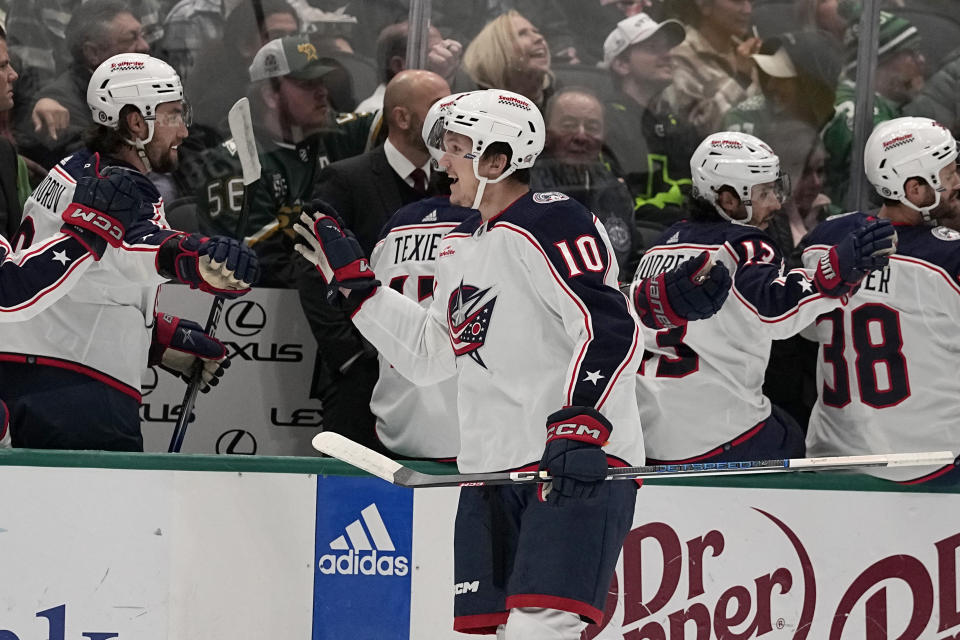 Columbus Blue Jackets' Dmitri Voronkovm (10) celebrates with the bench after scoring against the Dallas Stars in the first period of an NHL hockey game, Monday, Oct. 30, 2023, in Dallas. (AP Photo/Tony Gutierrez)