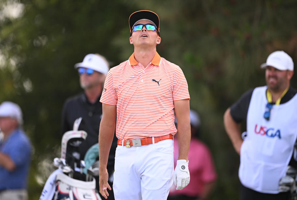 Rickie Fowler of the United States reacts to his tee shot on the 11th tee during the final round of the 123rd U.S. Open Championship at The Los Angeles Country Club