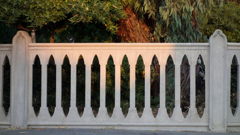 Ornate cut-out cement fence