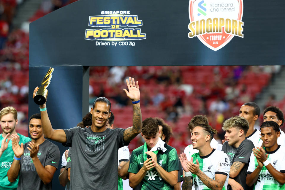 Liverpool captain Virgil van Dijk lifts the Standard Chartered Singapore Trophy after the 4-0 win over Leicester City at the National Stadium in Singapore. 