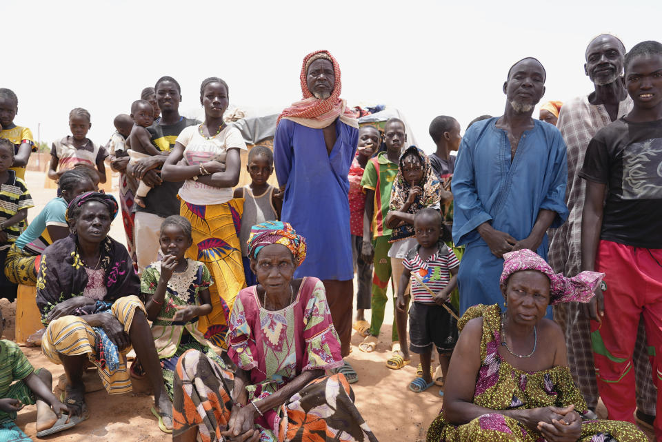 Internally displaced people wait for aid in Djibo, Burkina Faso, Thursday May 26, 2022. African leaders have gathered for a summit in Malabo, Equatorial Guinea, to address growing humanitarian needs on the continent, which is also facing increased violent extremism, climate change challenges and a run of military coups. Leaders on Friday called for increased mobilization to resolve a humanitarian crisis that has left millions displaced and more than 280 million suffering from malnourishment. (AP Photo/Sam Mednick)