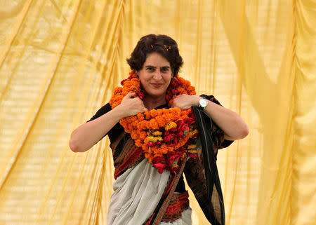 FILE PHOTO: Priyanka Gandhi Vadra adjusts her flower garlands as she campaigns for her mother Sonia Gandhi during an election meeting at Rae Bareli in Uttar Pradesh April 22, 2014. REUTERS/Pawan Kumar/File Photo