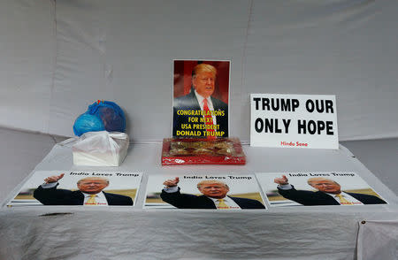 Posters of U.S. Republican presidential nominee Donald Trump are seen kept on a table during an event where members of Hindu Sena, a right-wing Hindu group, gather to symbolically celebrate his victory in the upcoming U.S. elections, in New Delhi, India, November 4, 2016. REUTERS/Adnan Abidi