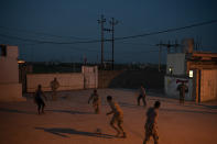 In this April 9, 2019 photo, Iraqi army 20th division soldiers play soccer in a military base in Badoush, Iraq. (AP Photo/Felipe Dana)