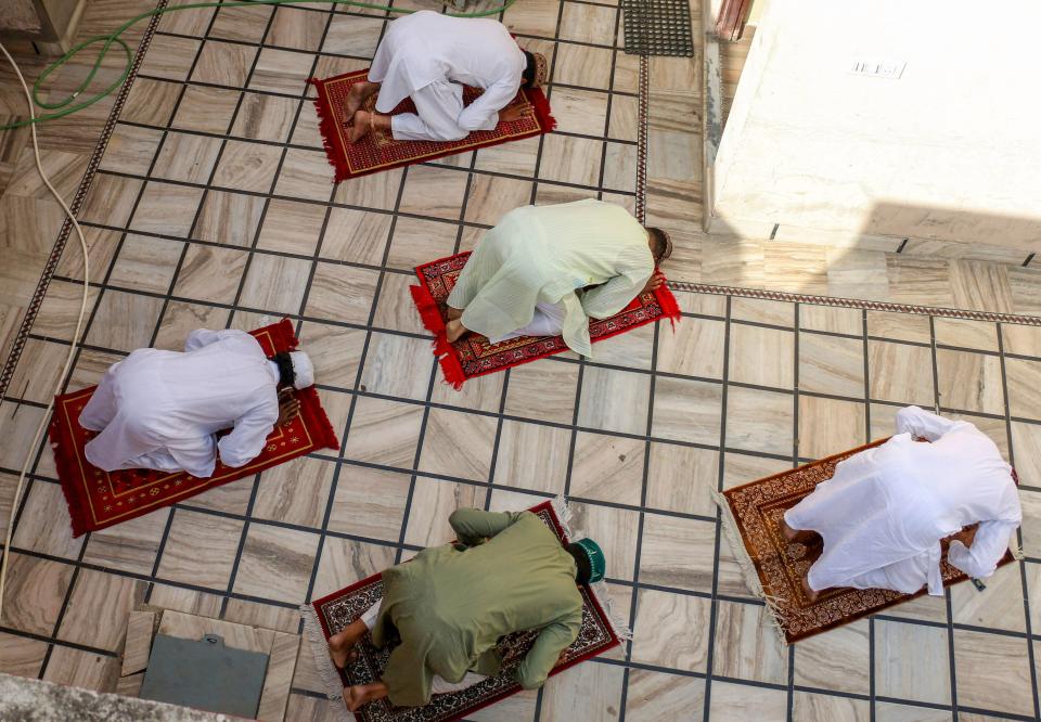 Muslim devotees offer prayers on the occasion of Eid-ul-Fitr, marking the end of holy fasting month of Ramadan, during the ongoing COVID-induced lockdown, at their residence in Ajmer, Friday, May 14, 2021.