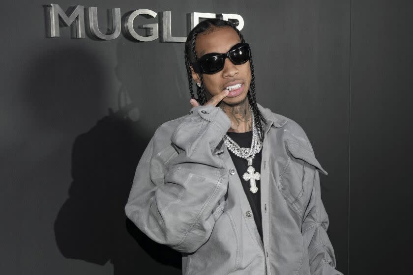 Tyga poses for photographers upon arrival at the Mugler x Hunter Schafer Party Tuesday, March 7, 2023 in Paris.