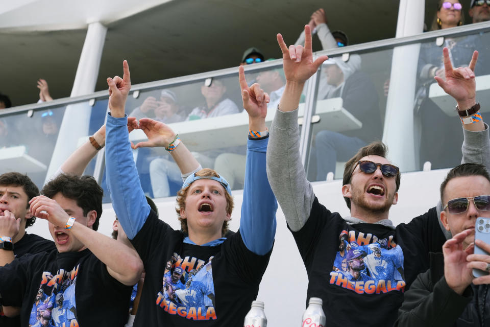 Supporters of golfer Sahith Theegala cheer him on at the 16th hole during the continuation of the second round of the Phoenix Open golf tournament, Saturday, Feb. 10, 2024, in Scottsdale, Ariz. (AP Photo/Ross D. Franklin)