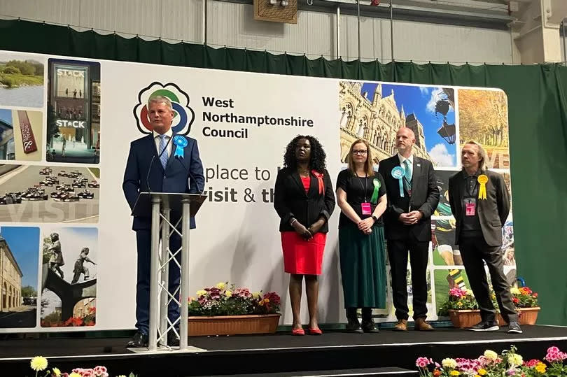Stuart Andrew speaking after it was announced the Conservatives won the Daventry seat (candidates behind left to right- Marianne Kimani, Clare Slater, Scott Cameron, Jonathan Harris)