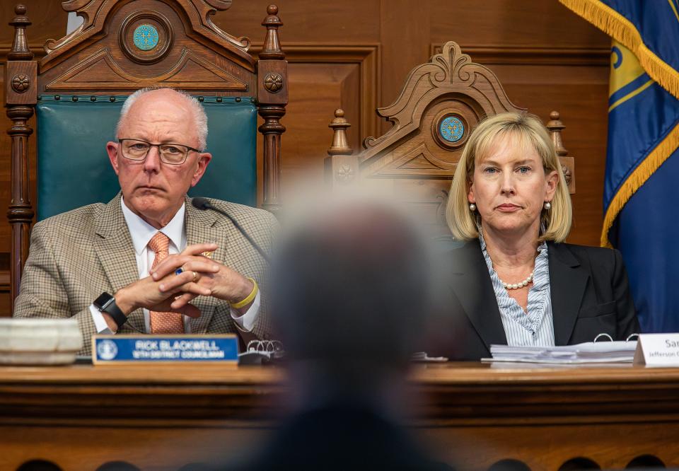 Metro councilmember Rick Blackwell, left, and Sarah Martin with the Jefferson County Attorney's Office, listened during opening arguements as the public hearing for Anthony Piagentini began on Monday night in the Louisville Metro Council chambers. The Council will weigh the removal of Piagentini following a commission's findings last year that he violated the ethics code. Monday Feb. 26, 2024