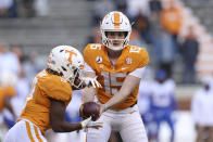 Tennessee quarterback Harrison Bailey (15) hands the ball off to running back Eric Gray (3) during the first half of the team's NCAA college football game against Florida on Saturday, Dec. 5, 2020, in Knoxville, Tenn. (Randy Sartin/Knoxville News Sentinel via AP, Pool)