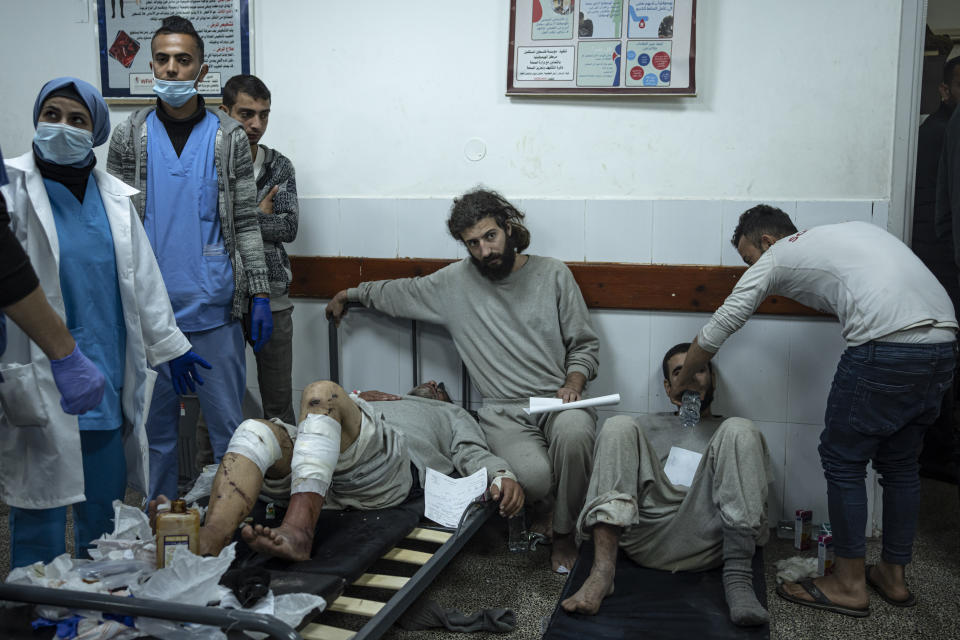 Palestinians who were arrested by the Israeli military in the north of the Gaza Strip and released through the Kerem Shalom crossing in the south wait for treatment in Rafah on Sunday, Dec. 24, 2023. (AP Photo/Fatima Shbair)
