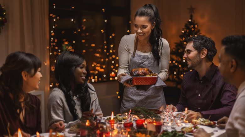 woman serving christmas dinner