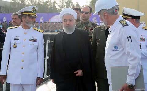 Iranian President Hassan Rouhani during the unveiling Iran's first semi-heavy submarine - Credit: AFP PHOTO / HO / IRANIAN PRESIDENCY