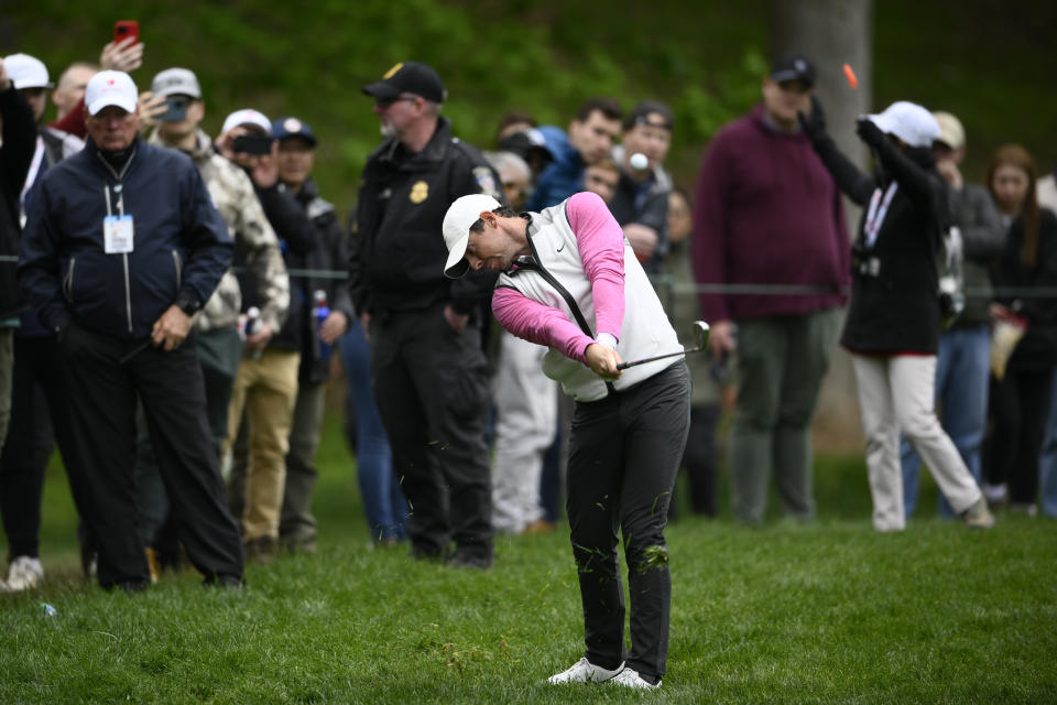 Rory McIlroy, of Northern Ireland, hits from the rough on the 10th hole during the final round of the Wells Fargo Championship golf tournament, Sunday, May 8, 2022, at TPC Potomac at Avenel Farm golf club in Potomac, Md. (AP Photo/Nick Wass)