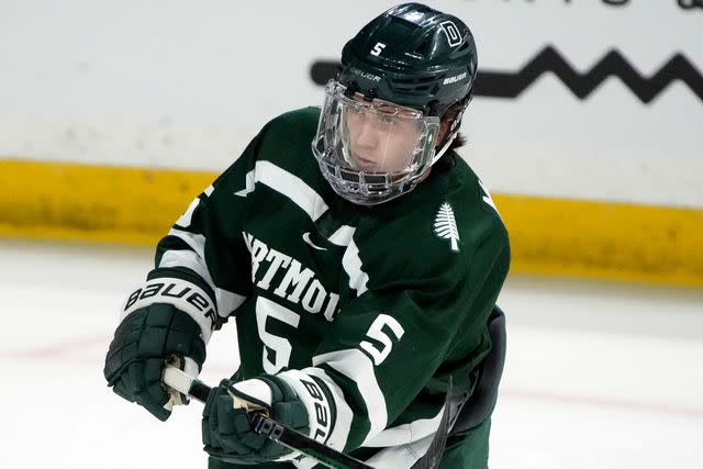 <p>Rick Scuteri/AP</p> Tucker McRae during an NCAA hockey game against Arizona State on December 8, 2023.