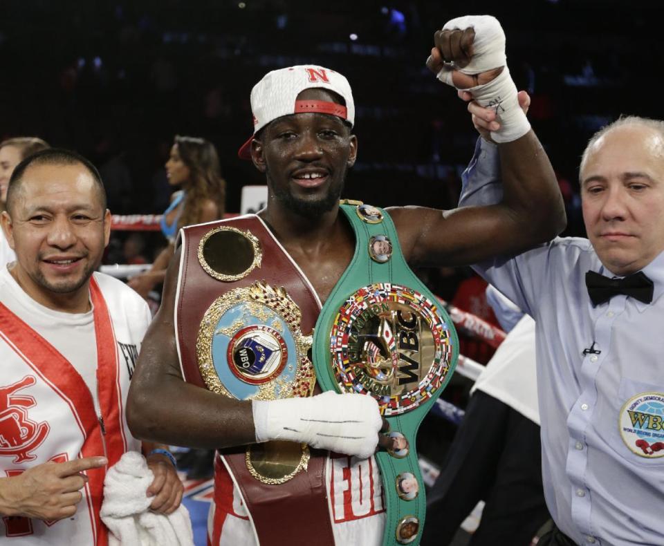 Terence 'Bud' Crawford is declared winner over John Molina Jr. after a WBO junior welterweight boxing bout at the CenturyLink Center in Omaha, Neb., Saturday, Dec. 10, 2016. Crawford won by TKO in the eighth round (AP Photo/Nati Harnik)