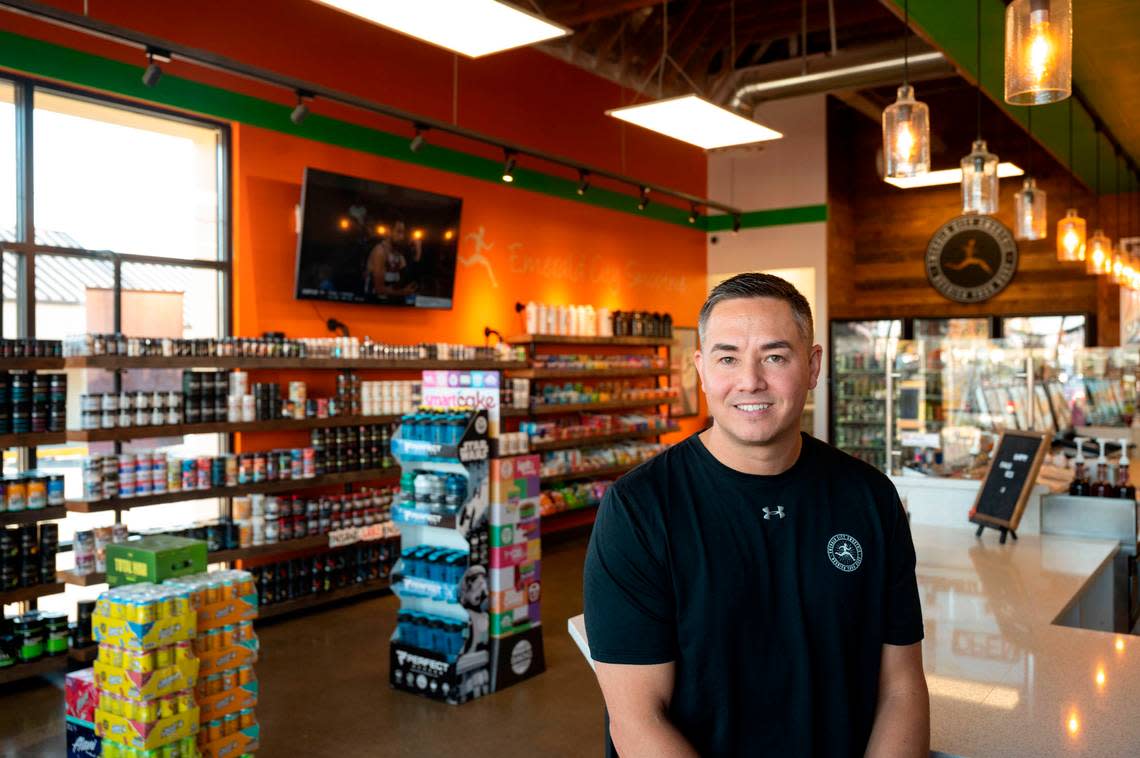 Chris Brown, owner of Emerald City Smoothie, poses for a portrait at Puyallup store on Friday, Nov. 18, 2022.