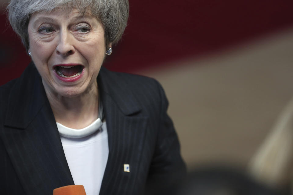 British Prime Minister Theresa May speaks with the media as she arrives for an EU summit at the Europa building in Brussels, Thursday, Dec. 13, 2018. EU leaders gather for a two-day summit, beginning Thursday, which will center on the Brexit negotiations. (AP Photo/Francisco Seco)