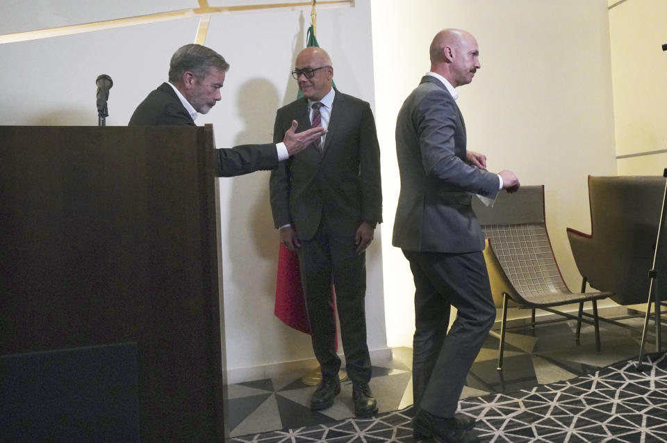 Norwegian diplomat Dan Nylander, right, Venezuelan opposition delegate Gerardo Blyde Perez, left, and President of the National Assembly of Venezuela, Jorge Rodriguez, center, exit a press conference in Mexico City, Monday Sept. 27, 2021. Delegates from Venezuela’s government and opposition held more talks in Mexico City on Monday after a delay that saw the government’s side arrive a day later than scheduled due to an apparent unhappiness with mediator Norway. (AP Photo/Marco Ugarte)