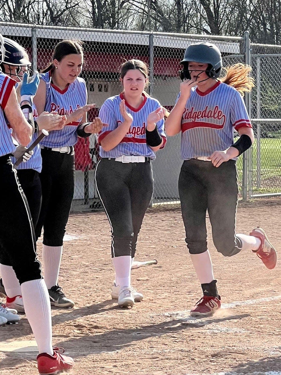 Ridgedale's Lilly Ruth hits a home run during a home softball game with North Baltimore this season.