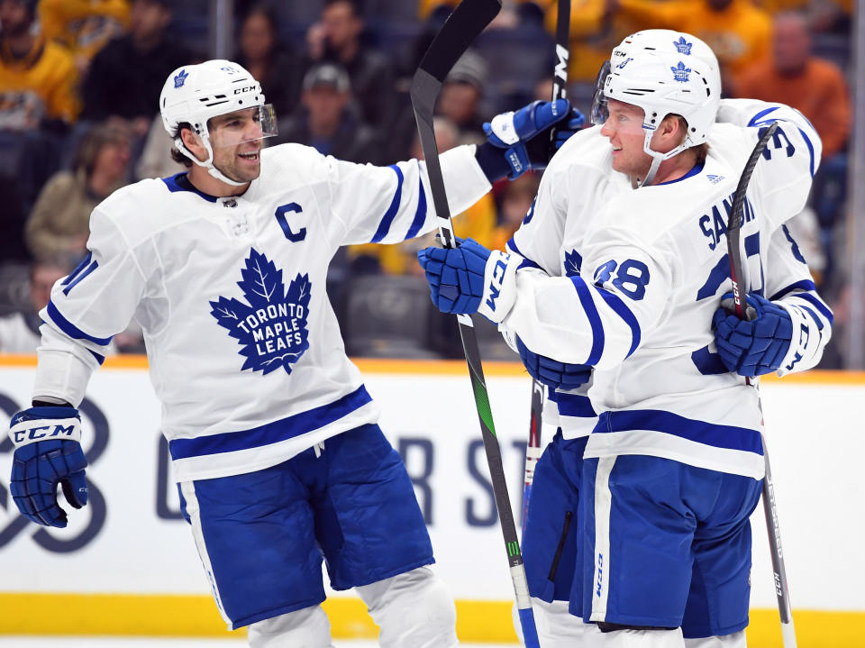 Jan 27, 2020; Nashville, Tennessee, USA; Toronto Maple Leafs defenseman Rasmus Sandin (38) celebrates with Toronto Maple Leafs center John Tavares (91) and Toronto Maple Leafs defenseman Cody Ceci (83) after a goal during the second period against the Nashville Predators at Bridgestone Arena. Mandatory Credit: Christopher Hanewinckel-USA TODAY Sports