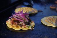 Tacos prepared by chef Mike Winneker appear at a makeshift kitchen outside of his home on April 3, 2021, in Scottsdale, Ariz. Beaten down by the pandemic, many laid-off or idle restaurant workers have pivoted to dishing out food with a taste of home. Some have found their entrepreneurial side, slinging their culinary creations from their own kitchens. (AP Photo/Ross D. Franklin)