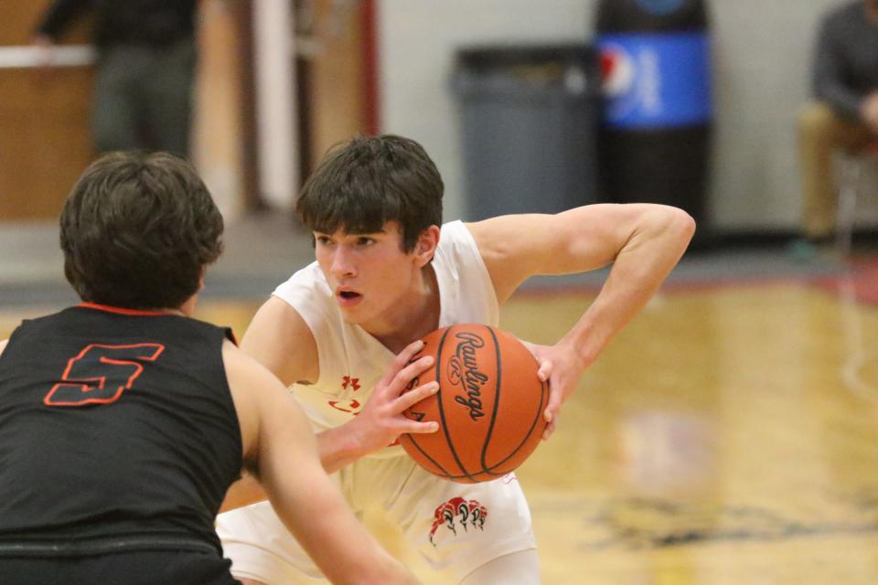 Crestview's Heath Kash scored nine points on three 3-pointers in the Cougars' 59-48 loss to Lucas on Tuesday night.