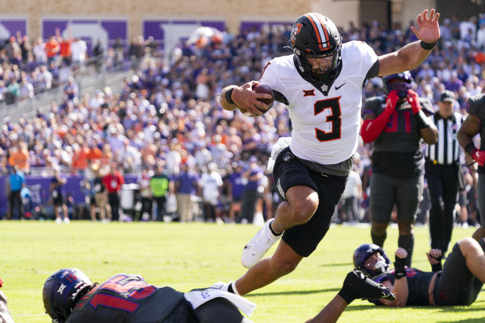 Oklahoma State quarterback Spencer Sanders (3) runs for a touchdown against TCU in Fort Worth, Texas, Saturday, Oct. 15, 2022. (AP Photo/Sam Hodde)