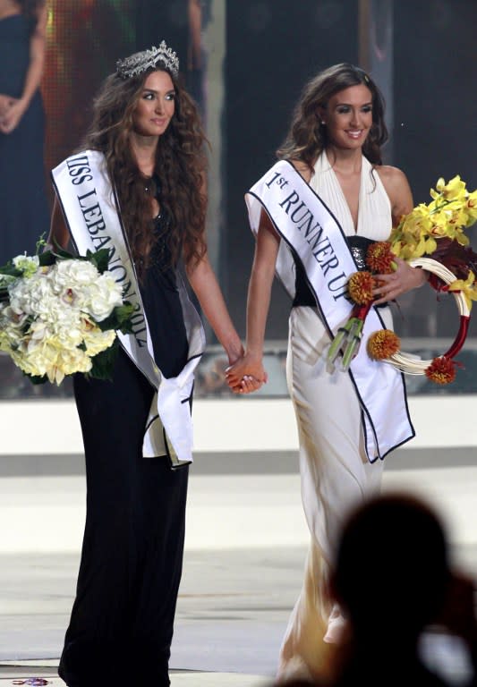 Miss Lebanon 2012 Rina Shibany and her twin sister and runner-up. AFP