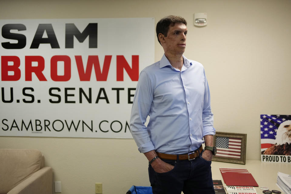 Nevada Republican Senate hopeful Sam Brown, a retired Army captain and Purple Heart recipient, stands in a campaign office Tuesday, June 14, 2022, in Las Vegas. (AP Photo/John Locher)