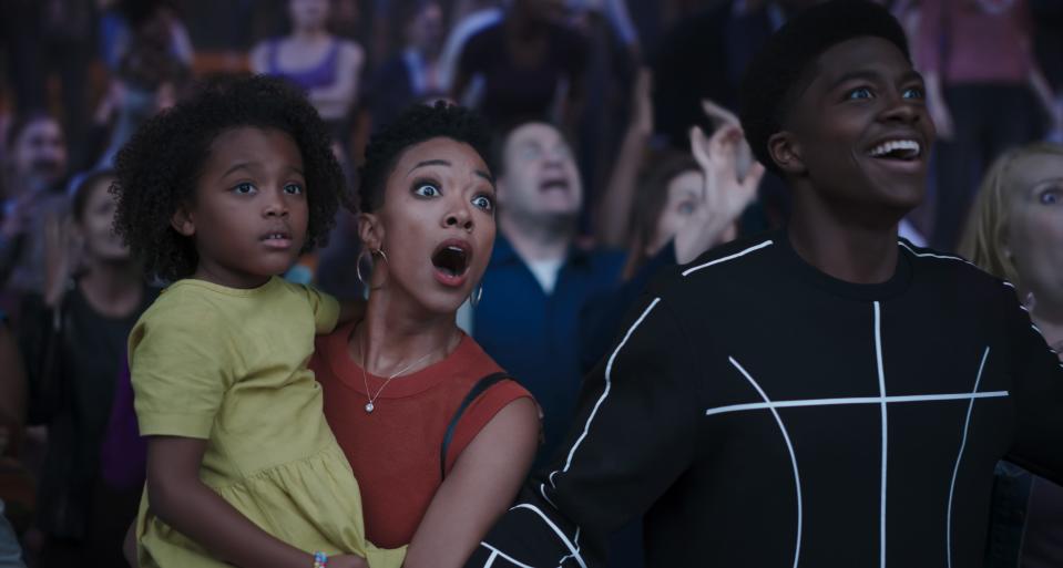 LeBron James' family also gets pulled into the "server-verse" in "Space Jam." They watch their father play in a high-stakes basketball game. (L-R) Harper Leigh Alexander as Xosha James, Sonequa Martin-Green as Kamiyah James and Ceyair J Wright as Darius James