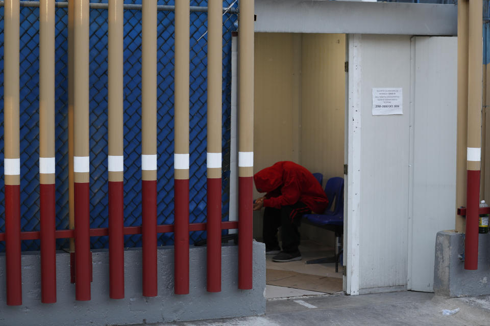 A man rests inside the COVID-19 triage area at the Mexico General Hospital, in Mexico City, Tuesday, May 12, 2020. Mexican officials said Monday that more than 100 medical personnel have died from the novel coronavirus, while thousands have been infected. (AP Photo/Rebecca Blackwell)