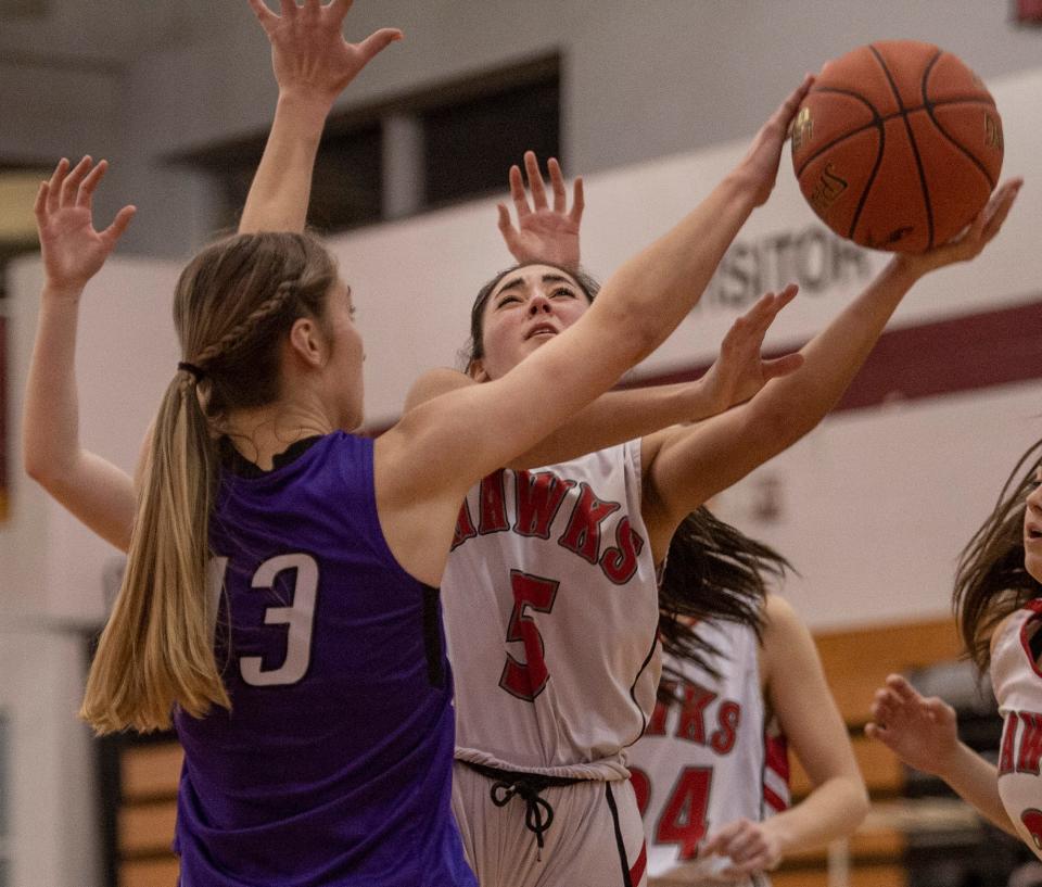 Hudson High School  senior Kaitlyn Puim fights through traffic  against Blackstone Valley Tech, Feb. 10, 2023.