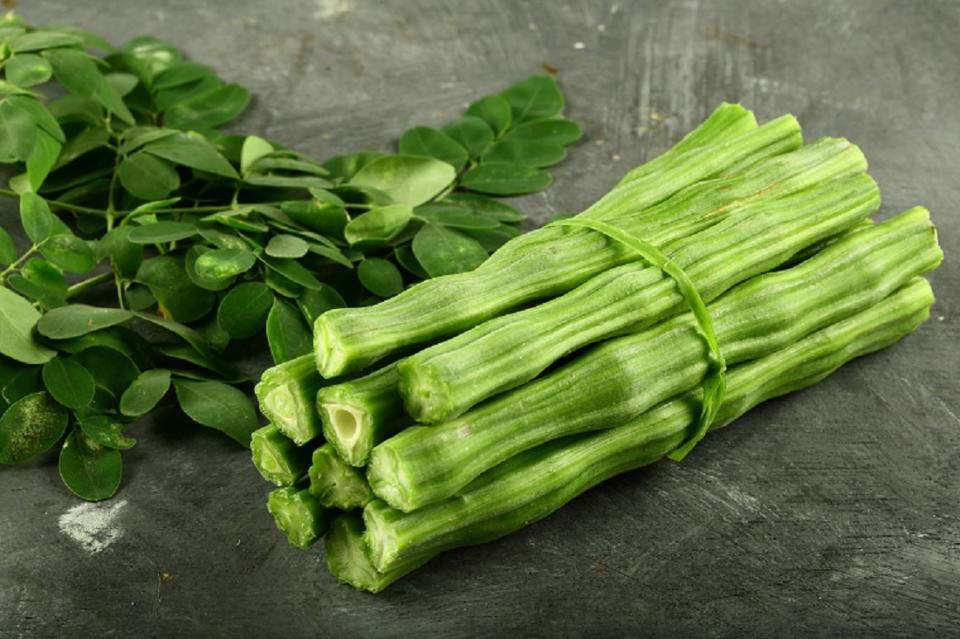 The green pods that look like sticks (hence called drumsticks) are used in many dishes like sambhar