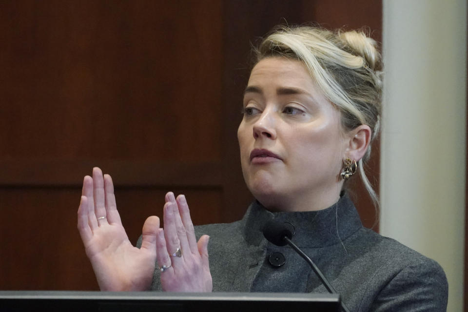 Actor Amber Heard testifies in the courtroom at the Fairfax County Circuit Courthouse in Fairfax, Va., Monday, May 16, 2022. Actor Johnny Depp sued his ex-wife Amber Heard for libel in Fairfax County Circuit Court after she wrote an op-ed piece in The Washington Post in 2018 referring to herself as a "public figure representing domestic abuse." (AP Photo/Steve Helber, Pool)