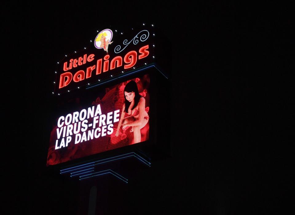 A sign at Little Darlings Las Vegas strip club advertises "coronavirus-free lap dances" March 19 despite a 30-day shutdown of nonessential businesses recommended by Nevada Gov. Steve Sisolak.