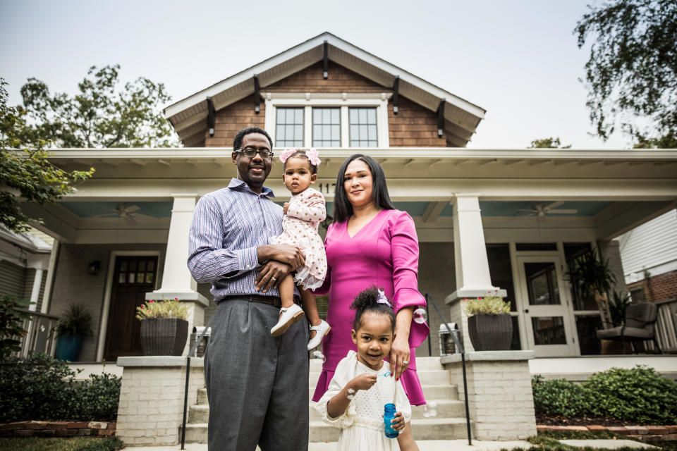 Portrait of family outside of home