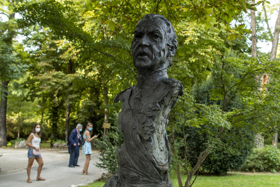 A statue bust of Spain's former monarch, King Juan Carlos I is pictured at the "Jardines del Campo del Moro" in Madrid, Spain, Monday, Aug. 3, 2020. Spain's royal family website on Monday Aug. 3, 2020, published a letter from Spain's former monarch, King Juan Carlos I, saying he is leaving Spain to live in another country, amidst a financial scandal. (AP Photo/Manu Fernandez)