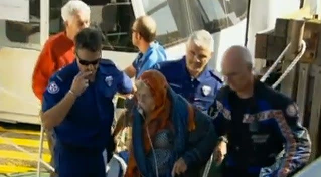 The lady was helped to safety by paramedics. Photo: 7 News