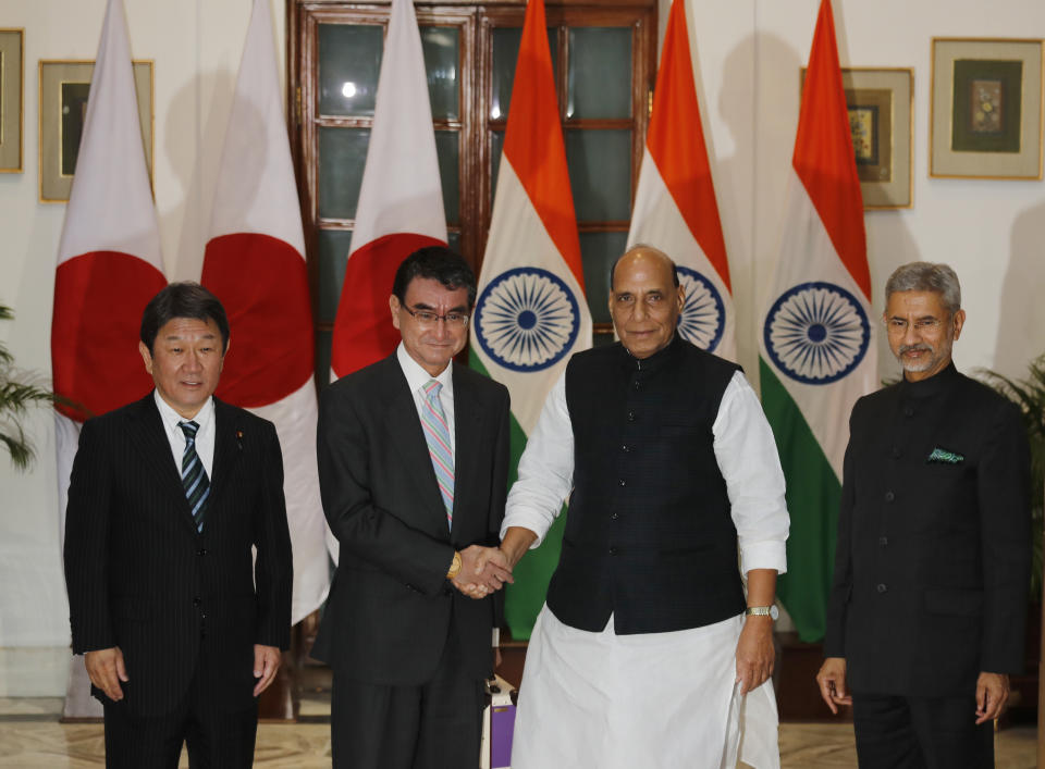Indian Defense Minister Rajnath Singh, second right, Japanese Defense Minister Taro Kono, second left, Indian Foreign Minister S. Jaishankar, right, and Japanese counterpart Toshimitsu Motegi pose for the media before the start of India Japan 2+2 talks, in New Delhi, India, Saturday, Nov. 30, 2019, to boost bilateral security and Defence cooperation between the two countries. (AP Photo/Manish Swarup)