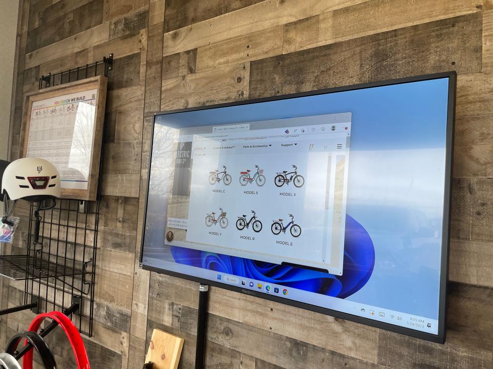 A touchscreen monitor that allows customers to design a custom bike at E-Bikes and More on March 24, 2023.