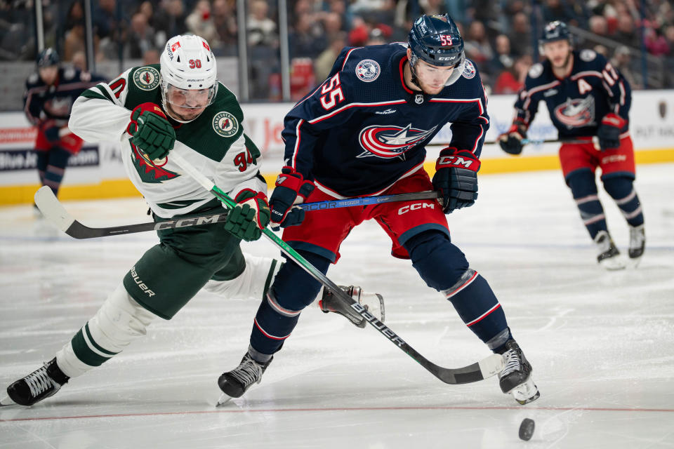 Jan 6, 2024; Columbus, Ohio, USA;
Columbus Blue Jackets defenseman David Jiricek (55) fights for the puck against Minnesota Wild left wing Marcus Johansson (90) during the second period of their game on Saturday, Jan. 6, 2024 at Nationwide Arena.