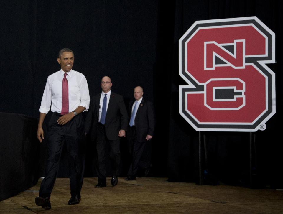 President Barack Obama arrives to talks about the economy, jobs and manufacturing, Wednesday, Jan. 15, 2014, at North Carolina State University in Raleigh, N.C. (AP Photo/Carolyn Kaster)